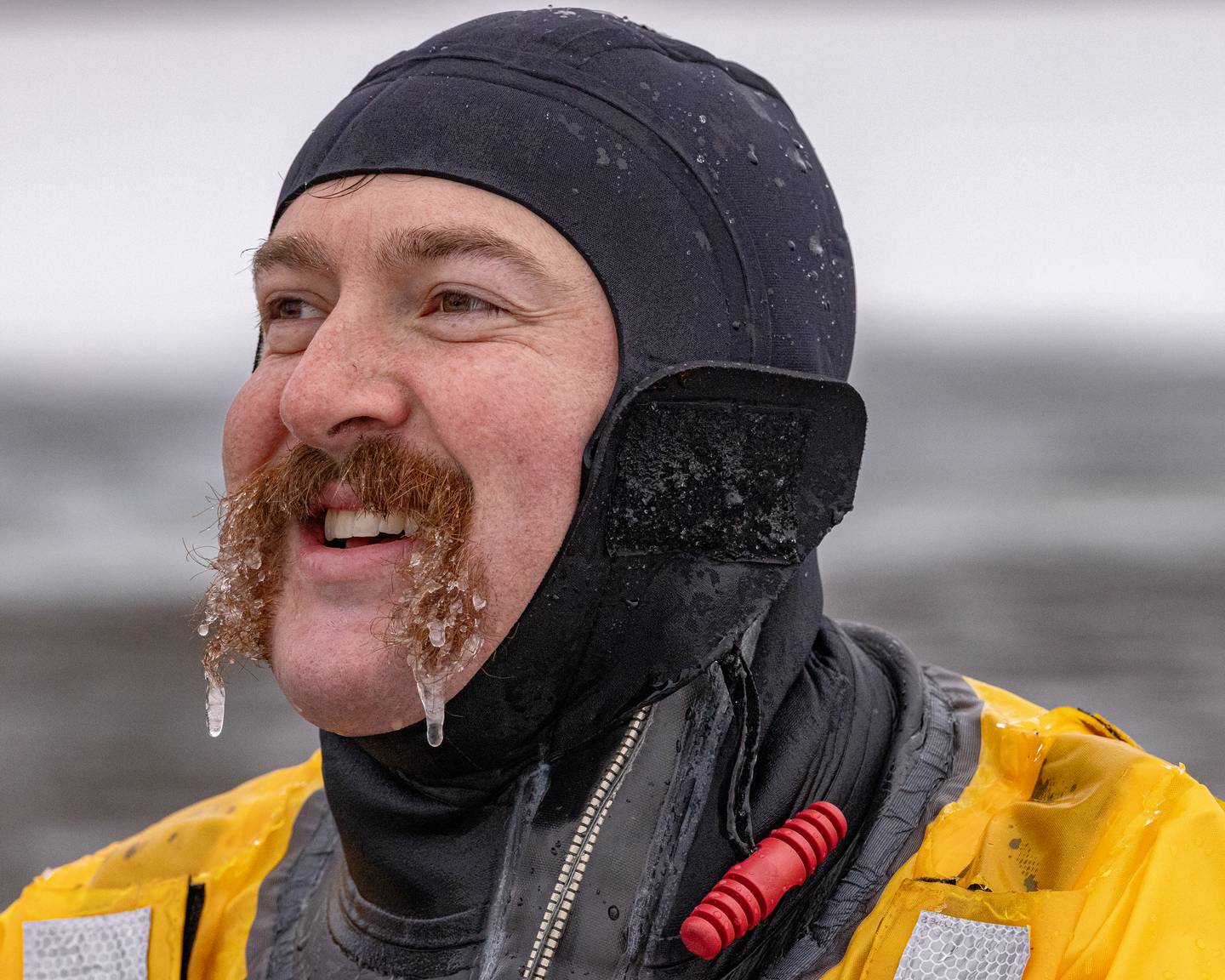 Ottawa Fire Department rescue diver, Brian Ksiazak has icicles form in his mustache as he helps protect swimming participants at the Make-A-Wish Illinois Penguin Plunge on  January 31, 2026 at Skydive Chicago.