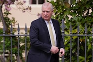 Britain’s Andrew Mountbatten-Windsor, formerly known as Prince Andrew, looks round as he...
