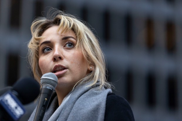 Congressional candidate Katherine "Kat" Abughazaleh speaks with supporters after a hearing for indicted Broadview immigration protesters on Nov. 12, 2025, at Dirksen U.S. Courthouse. (Brian Cassella/Chicago Tribune)