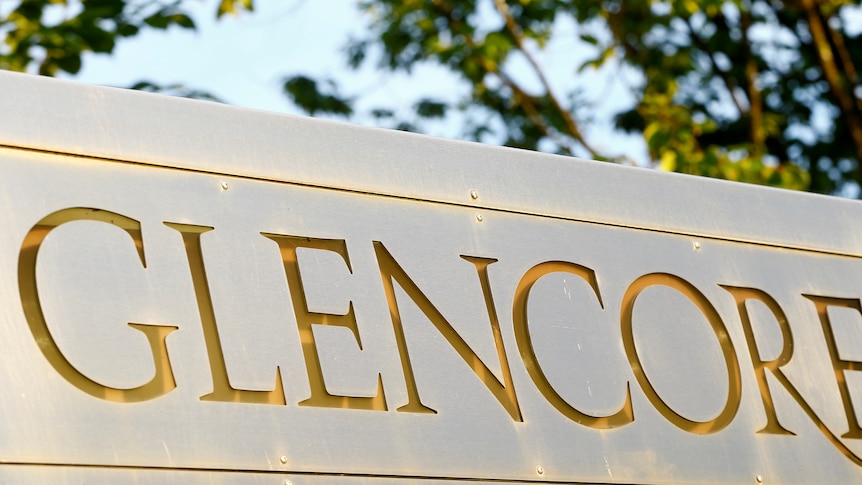 The logo of commodities trader Glencore is pictured in front of the company's headquarters