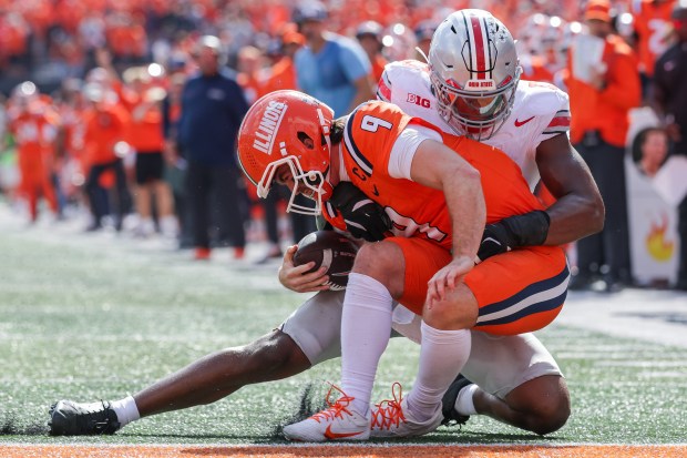 CHAMPAIGN, ILLINOIS - OCTOBER 11: Luke Altmyer #9 of the Illinois Fighting Illini runs the ball against Sonny Styles #0 of the Ohio State Buckeyes during the second half of the NCAA game Illinois Fighting Illini vs Ohio State Buckeyes at Memorial Stadium on October 11, 2025 in Champaign, Illinois. (Photo by Michael Hickey/Getty Images)