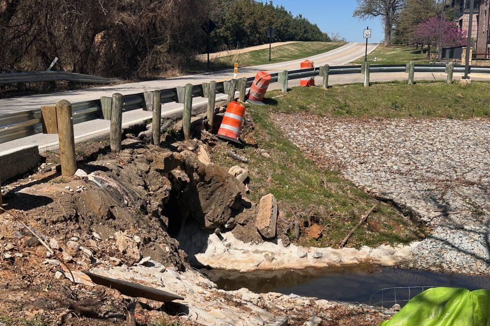 Construction cones sit on the side of Heritage Avenue
