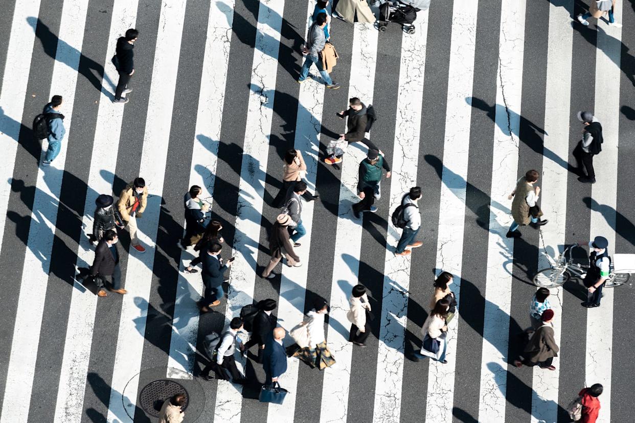 commuters walking at shibuya crossing, tokyo