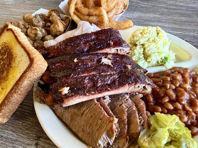 A combo plate with pork ribs, brisket and turkey at David’s Barbecue in Pantego, Texas, as seen Feb. 27, 2026.