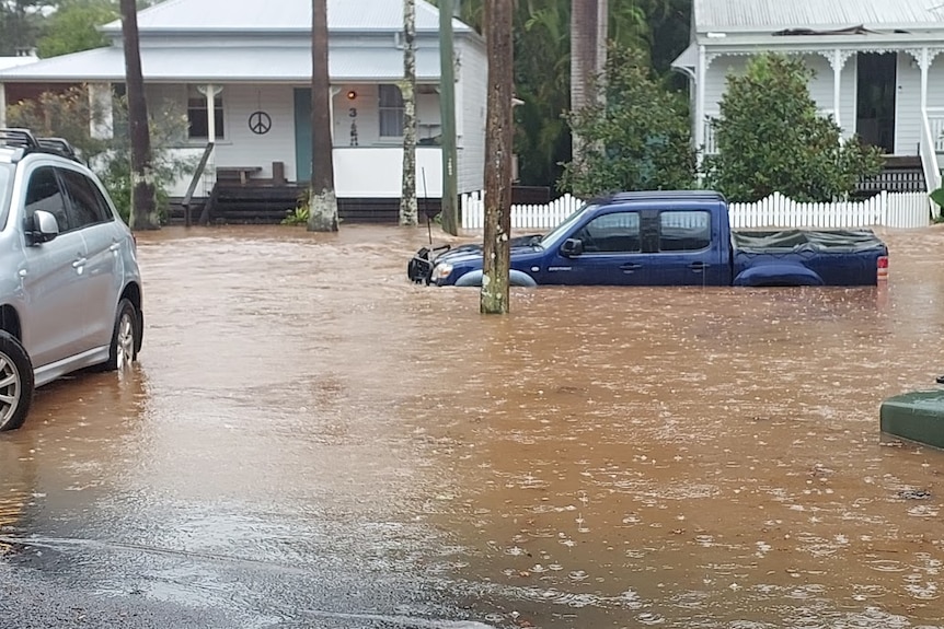 Flood waters submerged several cars on Deacon Street, Bangalow.