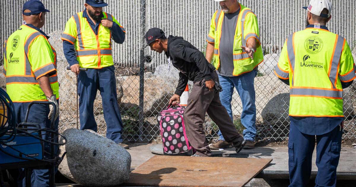 L.A. tries to close off manhole where people live, nearly sealing someone inside