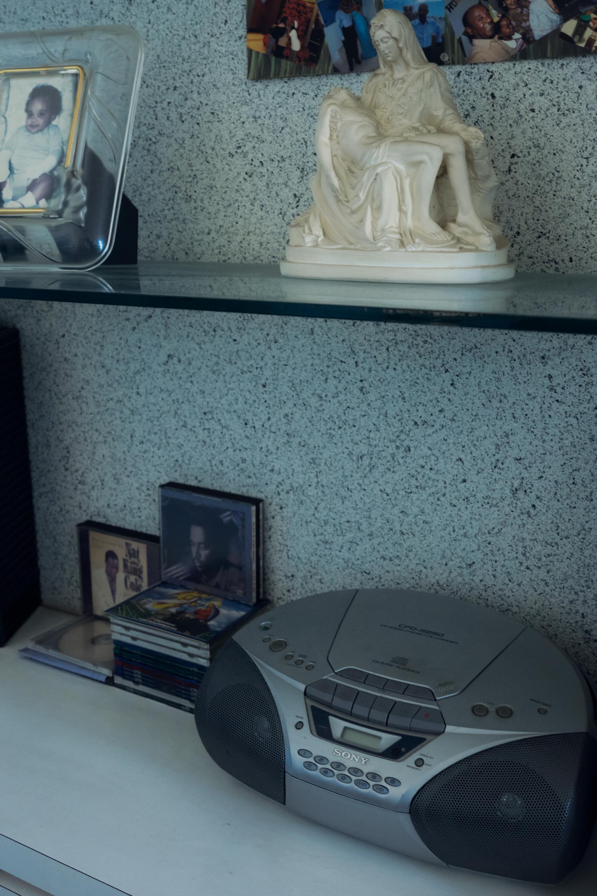 Items on a glass shelf inside Felema Ye's home. 