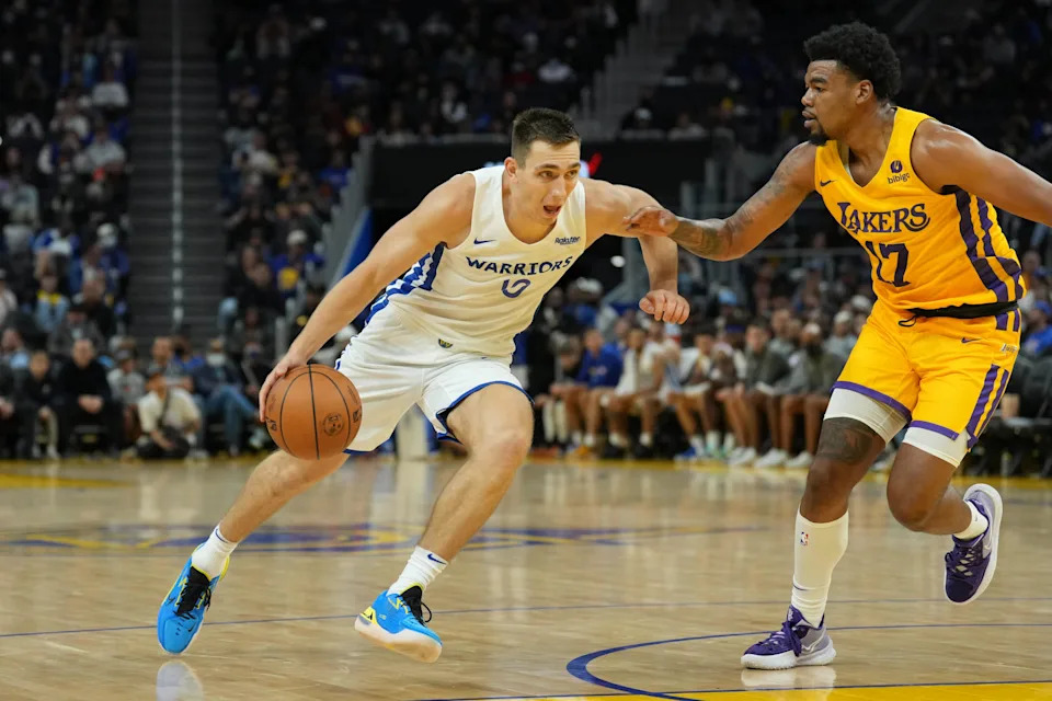 Jul 3, 2022; San Francisco, CA, USA; Golden State Warriors guard Justinian Jessup (10) dribbles against Los Angeles Lakers guard Mason Jones (17) during the fourth quarter at the California Summer League at Chase Center. Mandatory Credit: Darren Yamashita-USA TODAY Sports