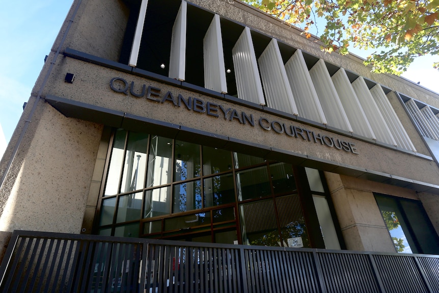 A two-storey, concrete building with "Queanbeyan Courthouse" lettered on the facade.