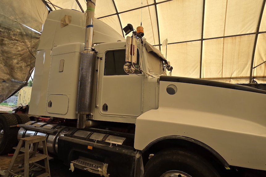 A large prime move parked in a shed
