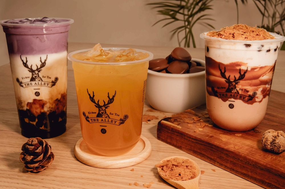 Three different type of drinks from The Alley placed on a table.