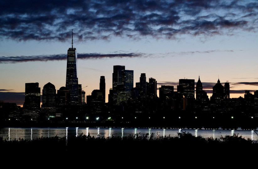 The skyline of Lower Manhattan is seen at dawn from across the Hudson River in New York City, US, October 18, 2025.