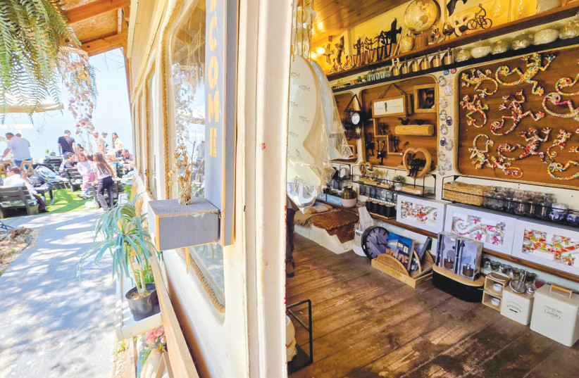 A Gathering at Ramot: Travelers and locals from across the country gather outside the vibrant artisan caravans of Lol Art, enjoying a shared communal experience overlooking the Sea of Galilee.