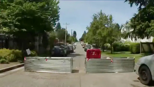 Residents in a Seattle neighborhood have begun erecting large barricades across streets after a surge of gun violence. X/@Dapper_Det