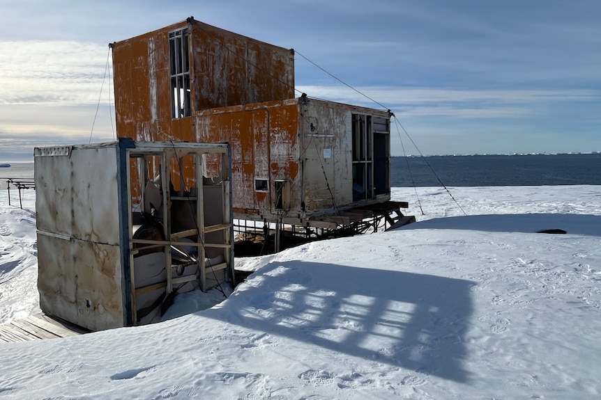 Images of an abandoned station in the icy and snowy Antarctic wilderness.