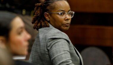 Ex-official accused of ignoring warnings student had gun faces trial