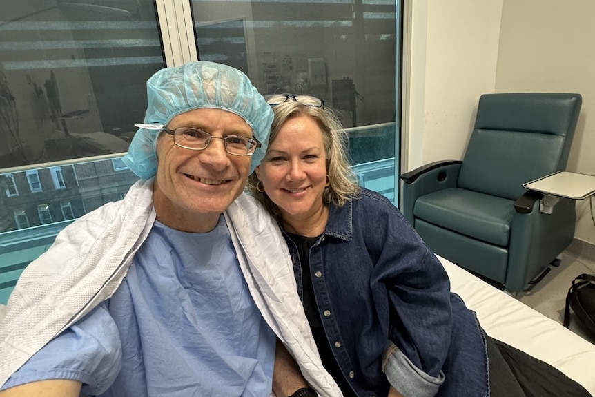 Professor Richard Scolyer sits with his wife following the surgery.