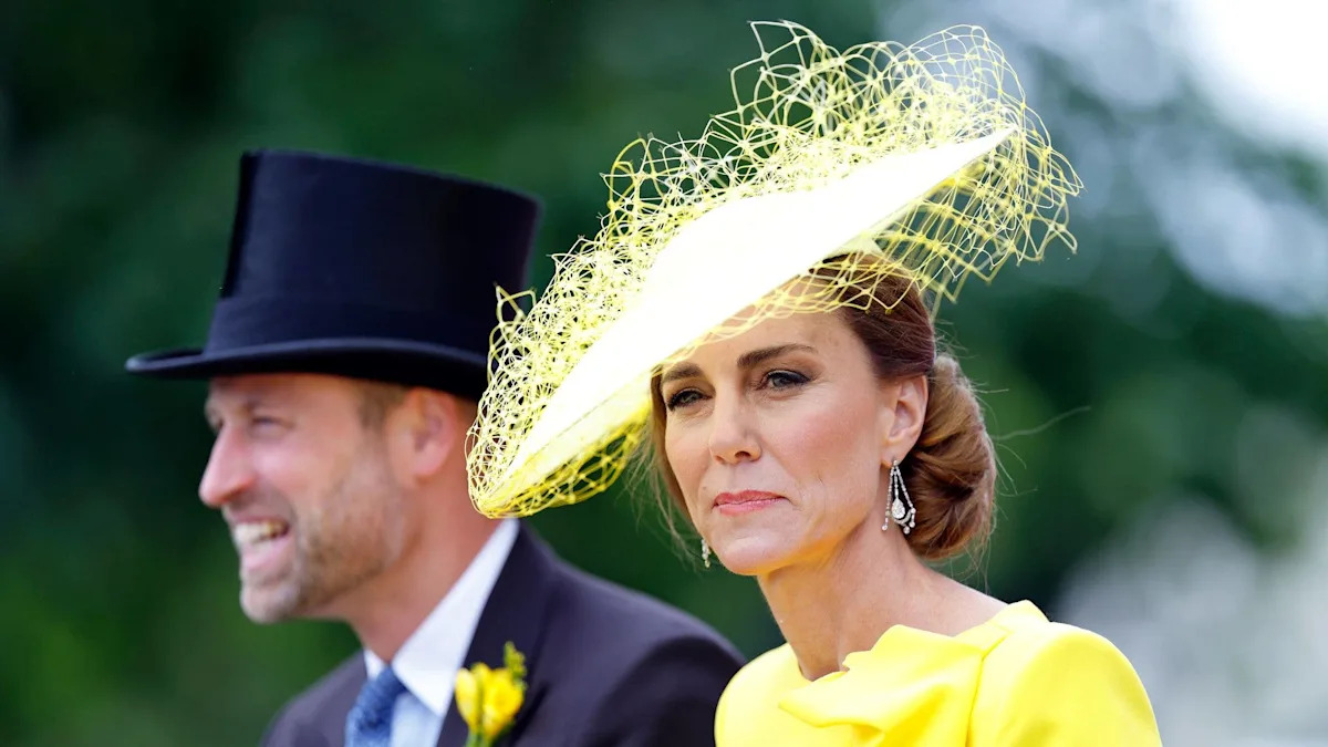 Prince William nudges Princess Kate to get her attention after she turns her back on him
