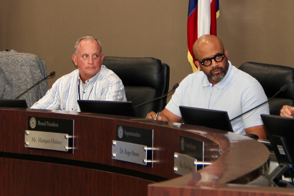 From left, Humble ISD board President Michael Grabowski and Position 6 trustee Marques Holmes deliberate during a board meeting. (Wesley Gardner/Community Impact)