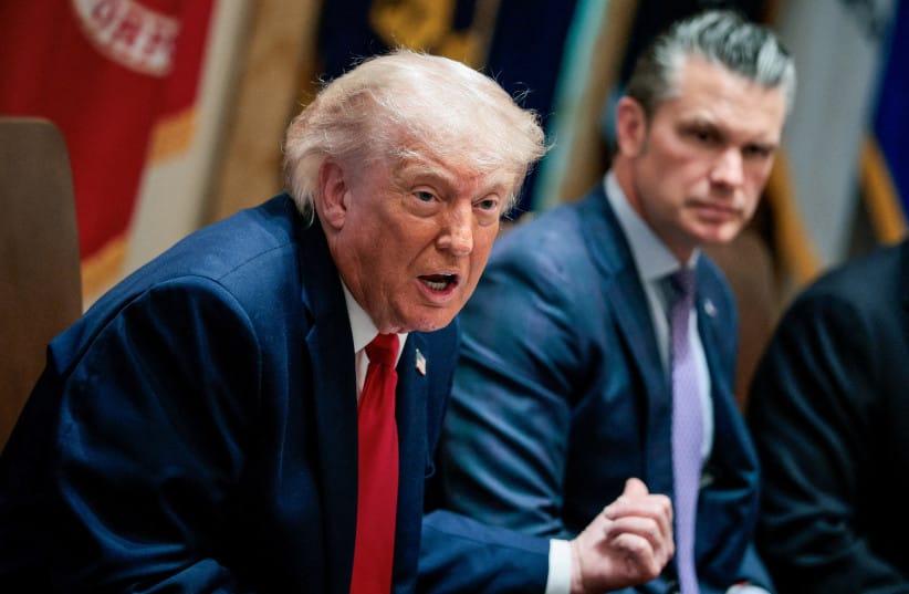 US President Donald Trump speaks next to Defense Secretary Pete Hegseth during a cabinet meeting in the Cabinet Room at the White House, in Washington.