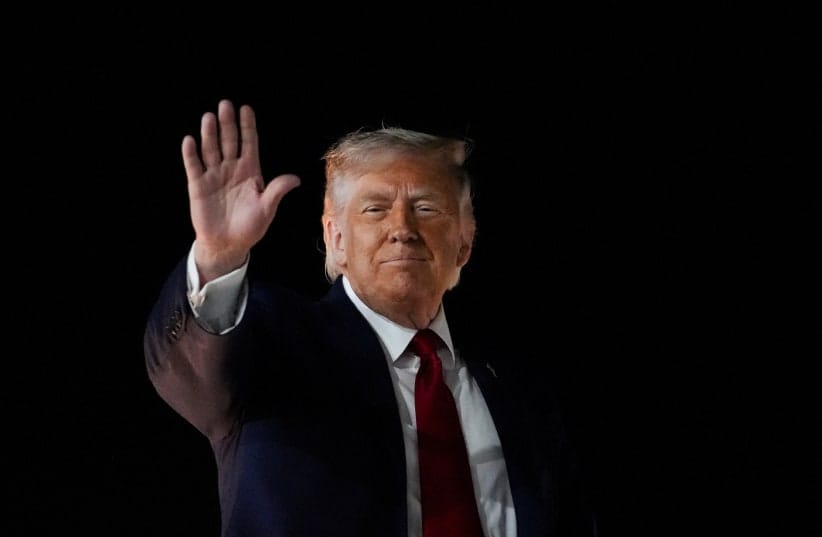 US President Donald Trump gestures as he boards Air Force One, after attending Game 3 of the NBA Finals, at John F. Kennedy International Airport in New York, June 8, 2026.