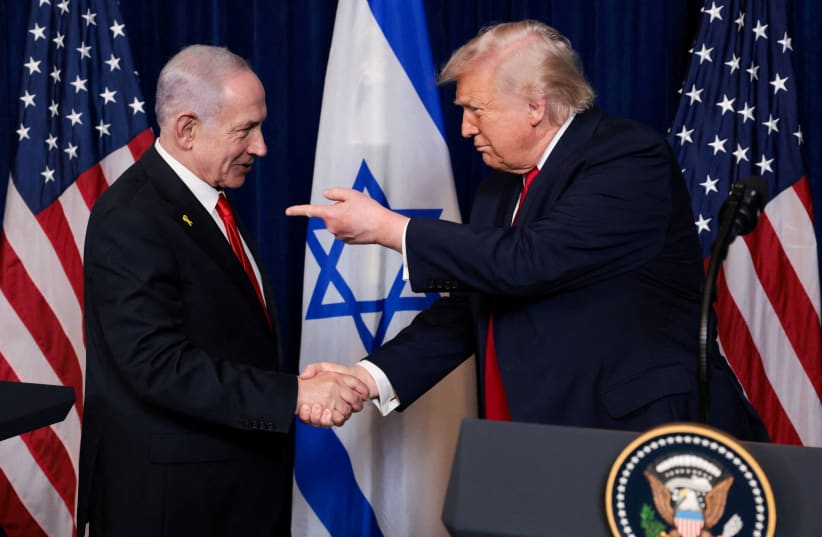 U.S. President Donald Trump points his finger towards Israeli Prime Minister Benjamin Netanyahu as they shake hands during a press conference after meeting at Trump’s Mar-a-Lago club in Palm Beach, Florida, U.S., December 29, 2025. 