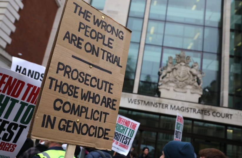 Protesters with placards attend outside Westminster Magistrates' Court on April 01, 2026 in London, England. The court rules in the case of Palestine Solidarity Campaign's Ben Jamal and Stop the War Coalition's Chris Nineham, who are accused of breaching protest restrictions in January 2025.