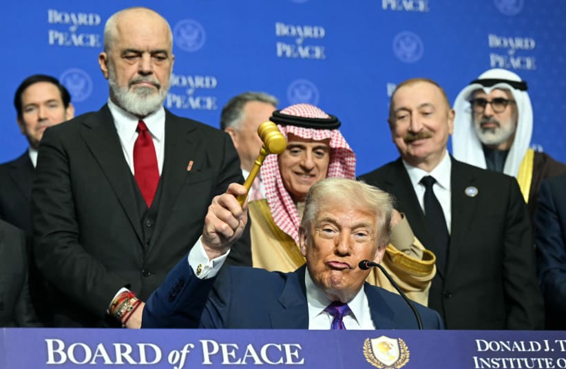 US President Donald Trump holds a gavel during a signing ceremony at the inaugural meeting of the "Board of Peace" at the US Institute of Peace in Washington, DC, on February 19, 2026.