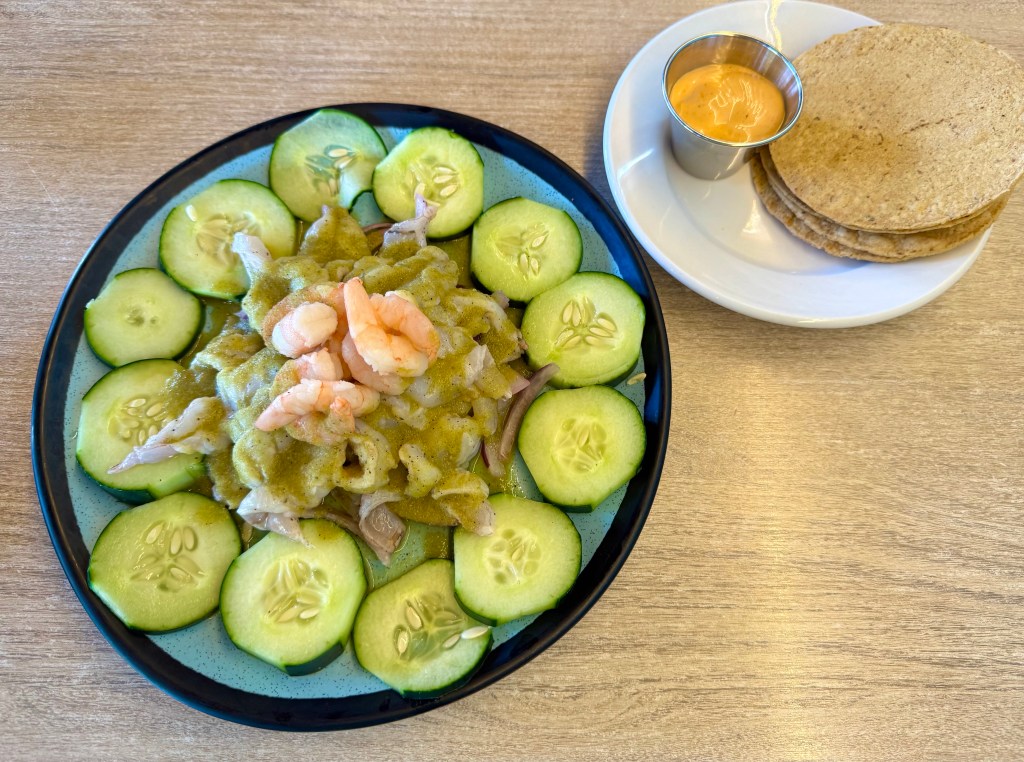 A large plate of Aguachile Verde with tostadas and a spicy aioli from PoNy's Miches Michelada Bar & Grill.
