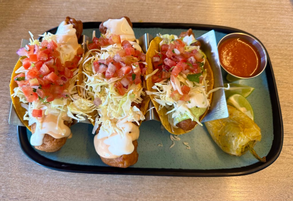 Two Mahi Mahi and one shrimp taco on a platter at PoNy's Miches.