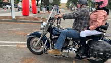 Lee Young (driver) and his wife Stella Delgadillo, prepare to leave the California Center for the Arts parking lot, Saturday, riding across North County, Escondido, Calif., June 27, 2026.