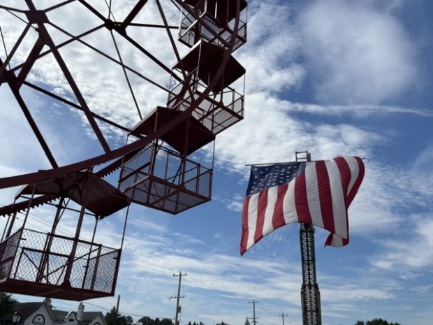 The American flag flies high thanks to the Phoenixville Fire Department as the Phoenix Wheel is in the foreground. (Photo by Barry Taglieber - For MediaNews Group)