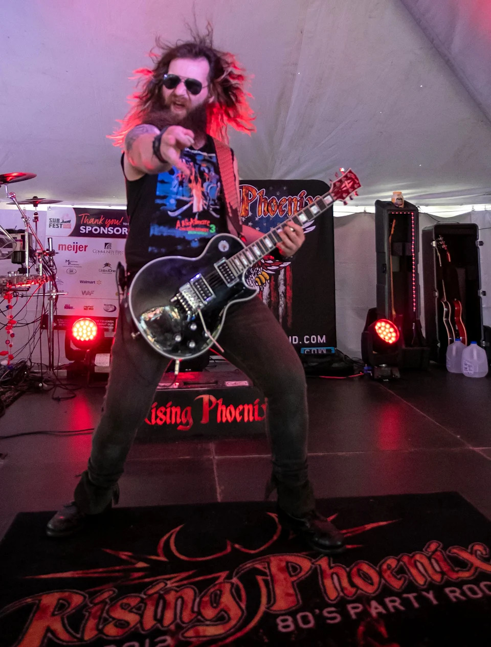 Rising Phoenix’s Axel Gessner strikes a pose on stage, Friday, July 4, 2025, in Manitowoc, Wis.