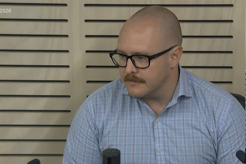 Man sitting being interviewed