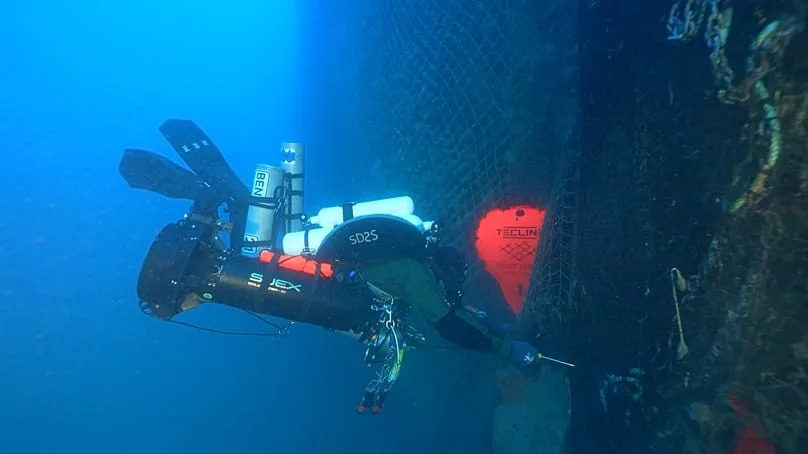A Ghost Diving volunteer removing an abandoned fishing net from the wreck