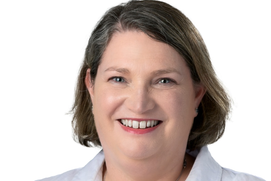 A woman smiling at the camera.