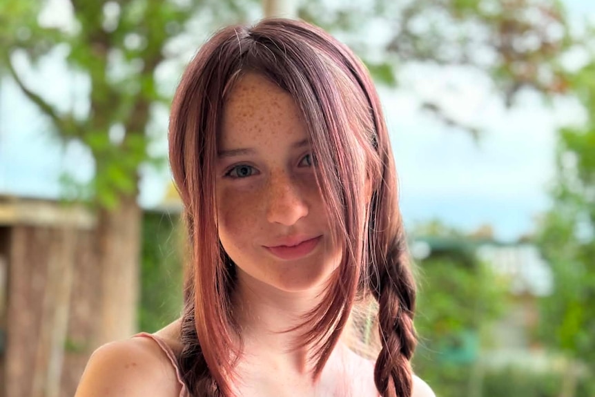 A picture of a girl looking at the camera