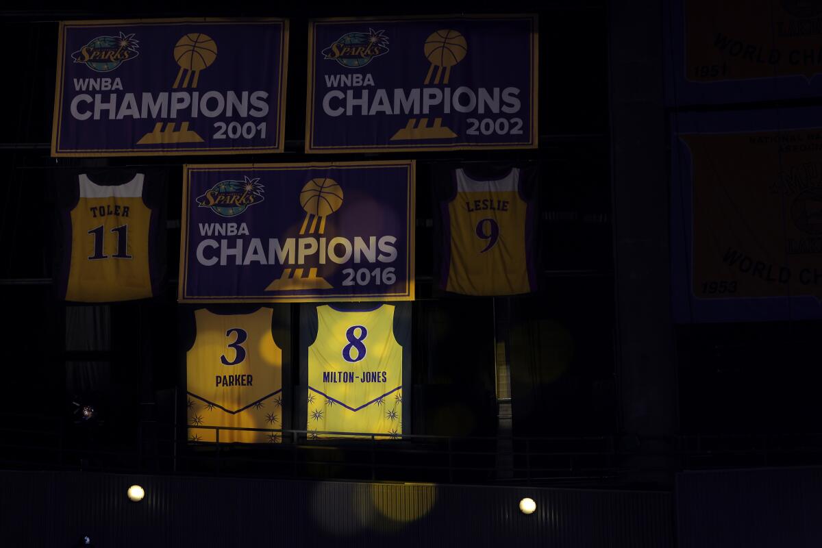 The retired Sparks jersey of DeLisha Milton-Jones is revealed during halftime Tuesday.