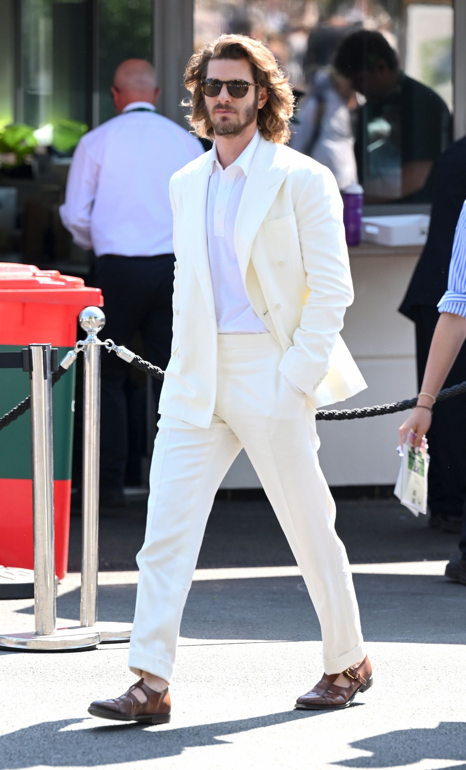 Image may contain Andrew Garfield Clothing Formal Wear Suit Blazer Coat Jacket Adult Person Accessories and Bag