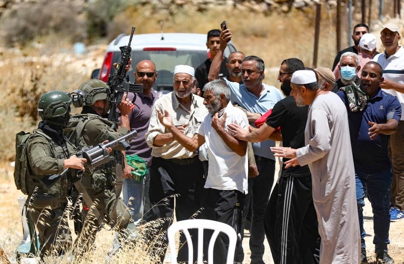 Israeli soldiers clash with Palestinians as they hold Friday prayers during a protest against Israeli settlement expansion and land confiscation near Bethlehem in the West Bank, July 3, 2026.