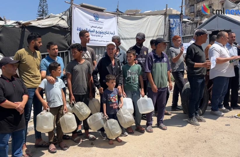  Employees of a water desalination plant speak to the press about the water crisis in the Gaza Strip. 