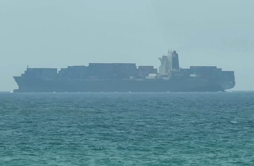 This frame grab taken from AFPTV video footage on July 12, 2026 shows a cargo ship anchoring near the Strait of Hormuz off the eastern coast of the United Arab Emirates at Khor Fakkan.