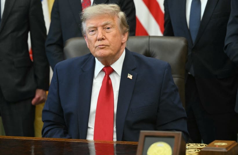US President Donald Trump looks on after signing an executive order to drastically shrink two national monuments in Utah, paving the way for fossil fuel extraction and mining, at the Oval Office of the White House in Washington, DC, on July 13, 2026.