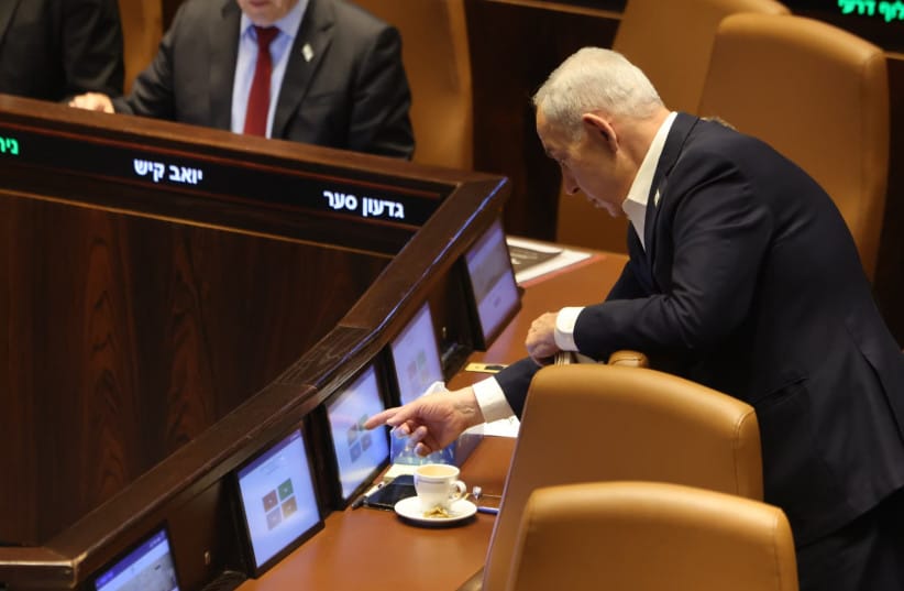 Prime Minister Benjamin Netanyahu votes on his government's communications reform in the Knesset plenum, in Jerusalem, July 16, 2026