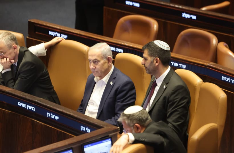 Prime Minister Benjamin Netanyahu and Communications Minister Shlomo Karhi are seen in the Knesset plenum during a vote on the minister's communications reform, in Jerusalem, July 16, 2026