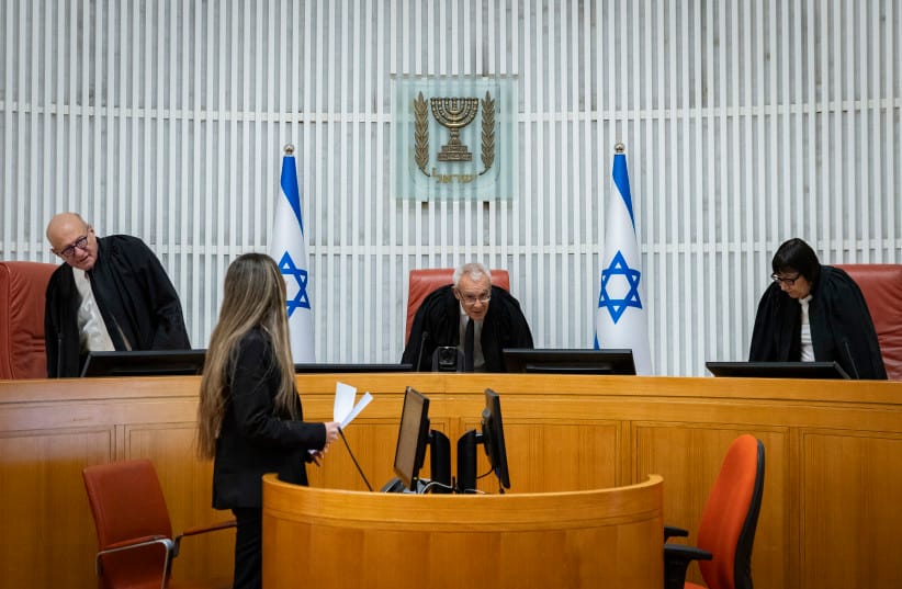 Supreme court justice Ofer Grosskopf (C) arrives for a hearing on a petition to convene the Judicial Selection Committee at the Supreme Court in Jerusalem, May 24, 2026.