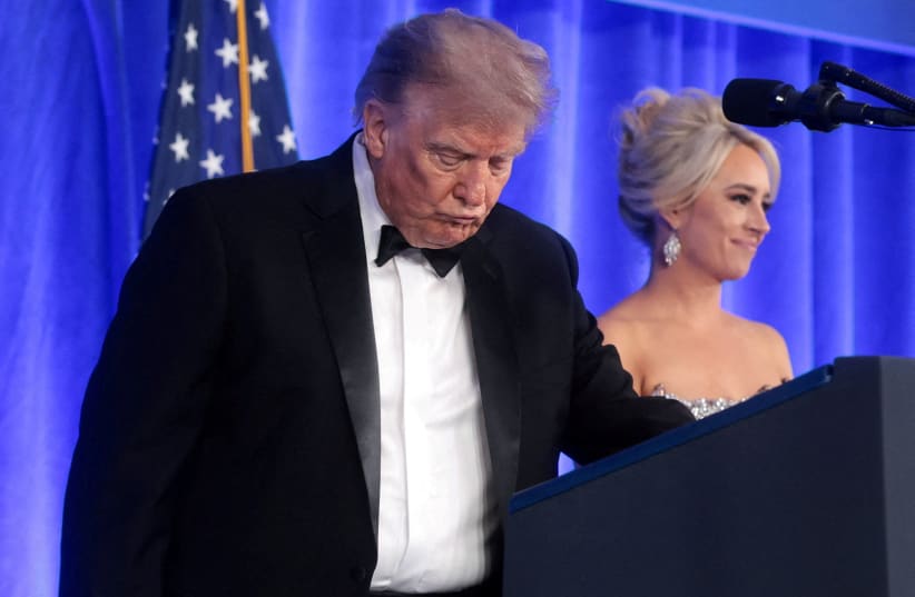 US President Donald Trump, with incoming White House Correspondents' Association (WHCA) President and Fox News Senior White House Correspondent Jacqui Heinrich, takes the lectern to deliver remarks at the WHCA Dinner, in Washington, DC, US, July 24, 2026. 