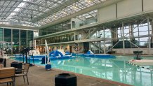 The nearly century-old indoor Plunge facility features a10,5000 square foot pool enclosed in a building with a retractable roof, July 26, 2026.