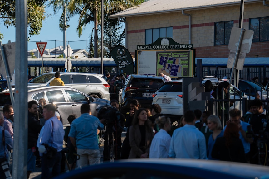 Parents milling outside a school