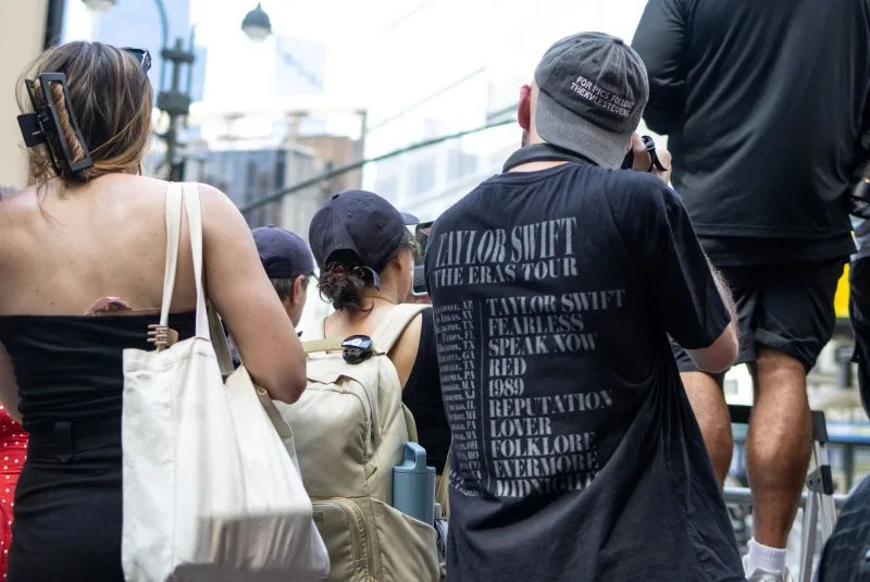 Fans wait on the street on the day of the Taylor Swift and Travis Kelce wedding on Friday at Madison Square Garden in New York City. Permits were filed to close portions of West 31st Street and West 33rd Street for the duration of events and the surrounding streets around MSG will be closed to both vehicles and pedestrians. Photo by Jonathan Fernandez/UPI